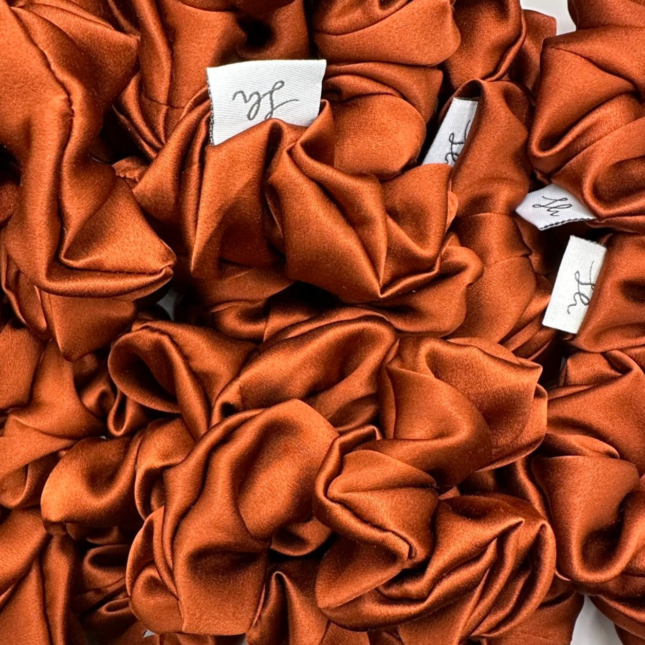 Síoda Silky 100% Mulberry Silk scrunchie size medium colour is Burnt Orange