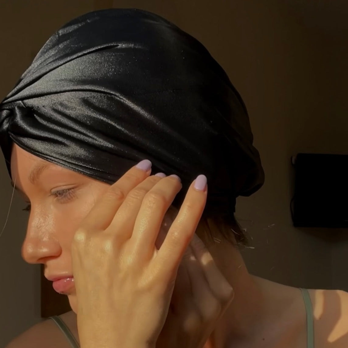 Beautiful woman wearing a 100% mulberry silk hair wrap bonnet turban
